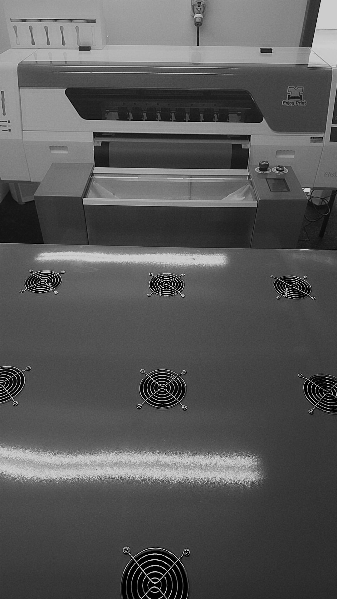 Close up of DTF (direct-to-film) printer machinery at Ōtautahi Print Co.